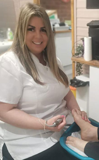 Lisa Mclachlan working on a client's foot